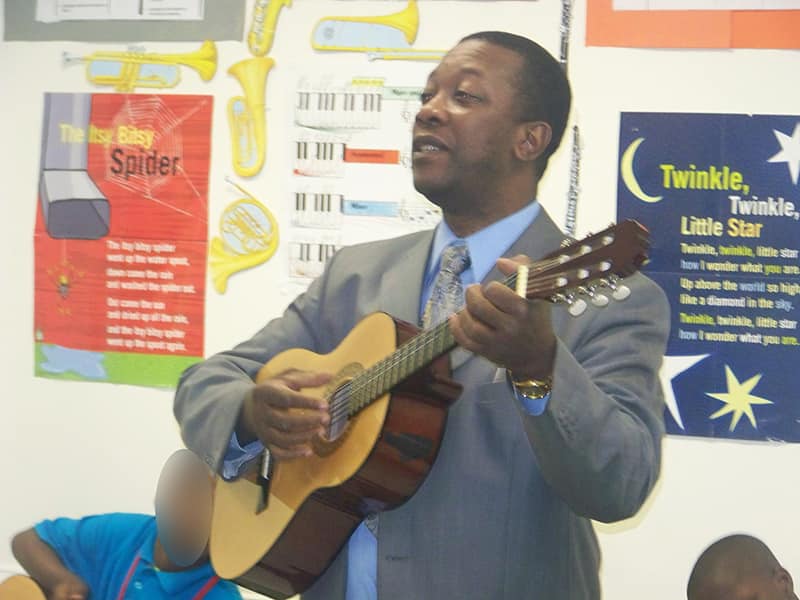 Playing the guitar with my students