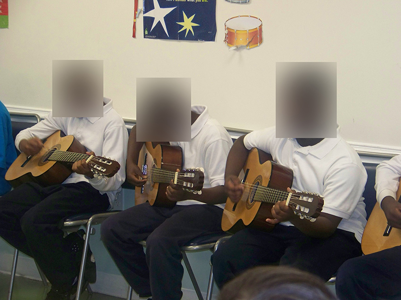 My students are performing on the guitar